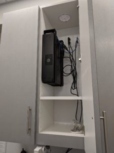 Photo of an office server mounted in a cubby