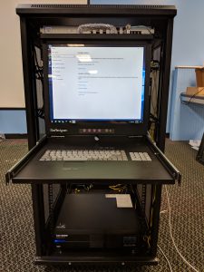 A monitor on the front of a new rack