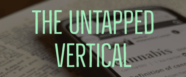 The Untapped Vertical Banner - Showing a phone with the word Cannabis on it, laying on a book