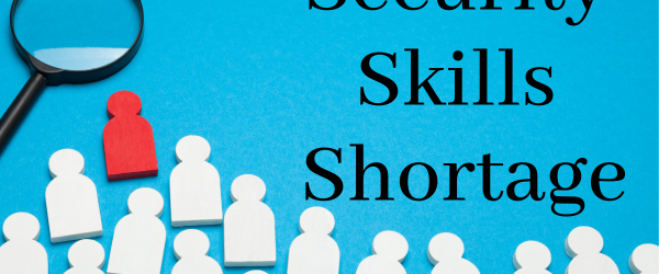 Security Skill Shortage Banner featuring wooden cutouts of people and a magnifying glass.
