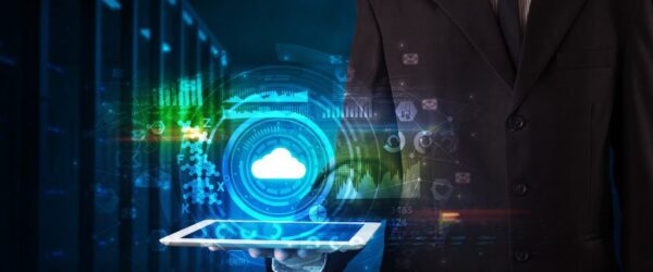 ways-managed-IT-services-improve-business A man in a suit representing Myrtle Beach managed services with a tablet showing IT icons.