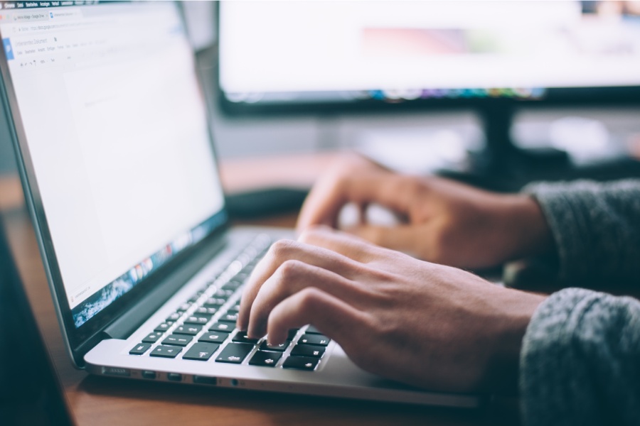 Individual implementing Wrightsville Beach cybersecurity measures while browsing the internet safely