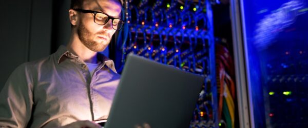 managed-IT-services A Wilmington-based managed service provider performing managed IT services from a laptop.