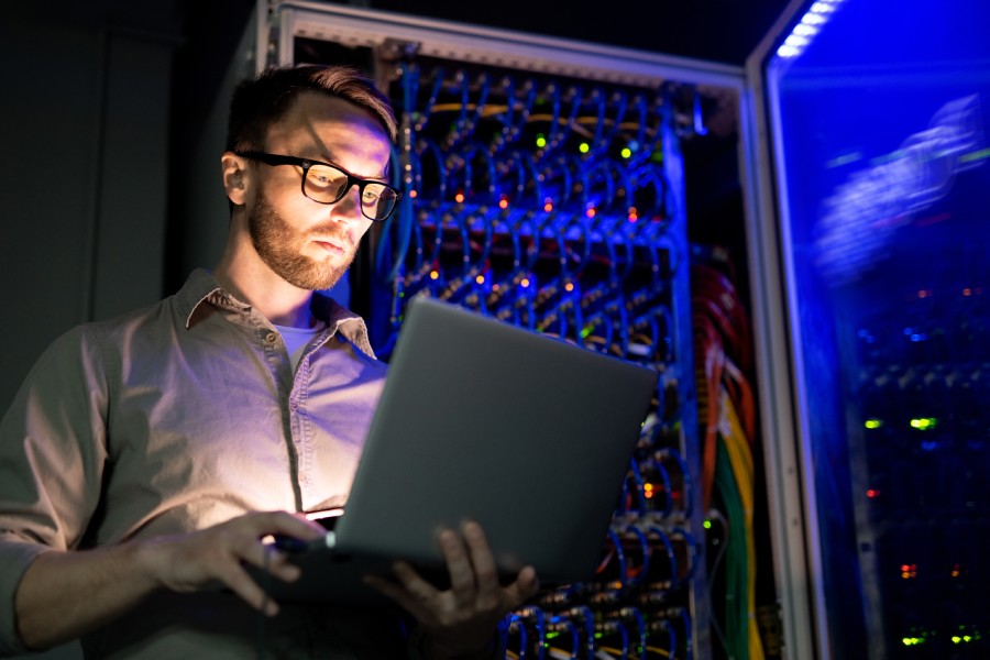 A Wilmington-based managed service provider performing managed IT services from a laptop.