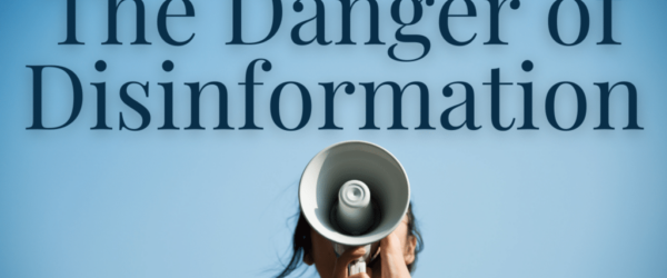 The words "The Danger of Disinformation" over a woman shouting through a megaphone.