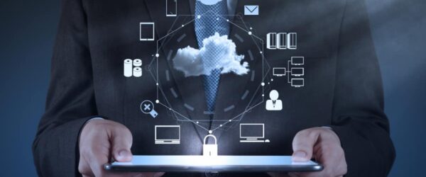 A representation of Wilmington cloud IT computing showing a man holding a tablet with a hologram.