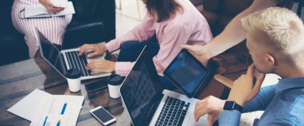 Managed IT agents in a Burgaw meeting brainstorming strategies to boost customer traffic for the client's business