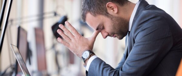 Frustrated business man struggling with downtime without outsourced IT in Wilmington