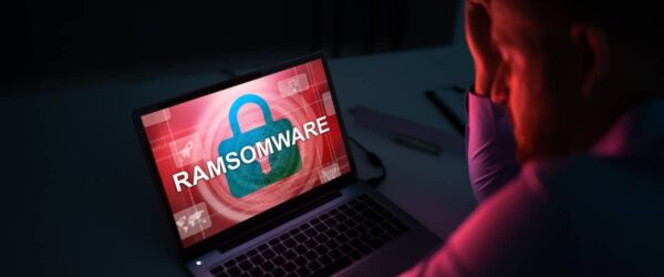 Anxious businessman in Warsaw fretting due to his business data loss over ransomware on his computer