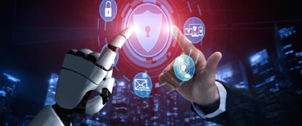 A robot hand and human hand touching, representing Wilmington cybersecurity.