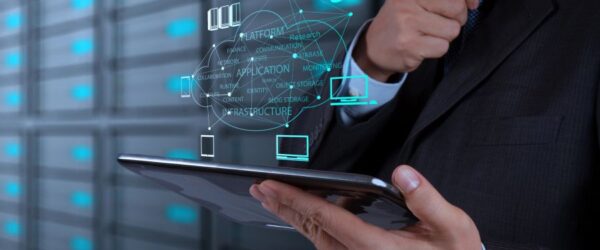 A businessman working on a tabled powered by cloud computing for businesses in Wallace.