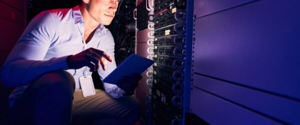How-Managed-IT-Providers-Can-Help-You-Optimize-Your-IT-Infrastructure-&-Operations A technician performing Myrtle Beach computer repair services in a server room.