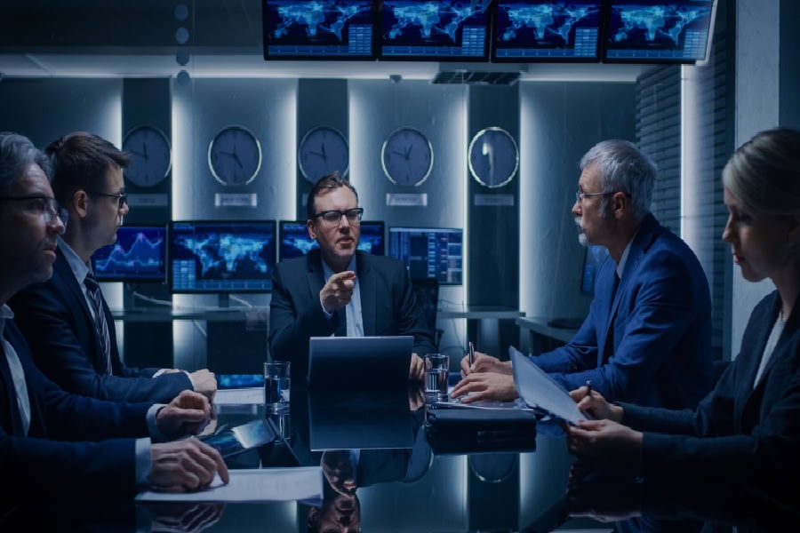 Professionals providing Wilmington managed IT services in a high-tech room.