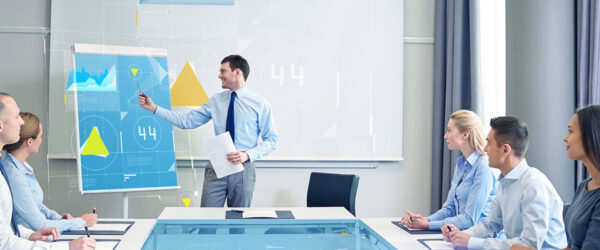 A team discussing Myrtle Beach managed services in a modern office setting.