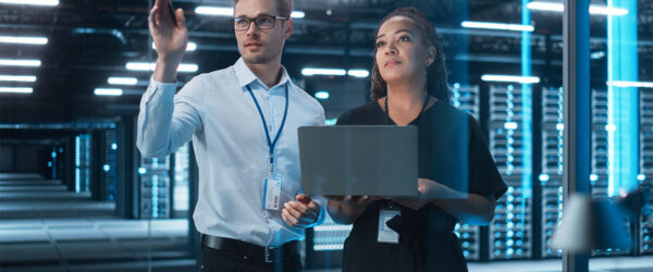 A Wilmington IT management team working in a high-tech server room.