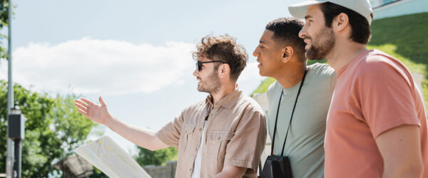 Three men with a map exploring a city, their data protected by Myrtle Beach IT support.