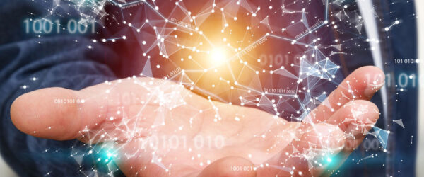 A Wilmington vCIO holding a glowing digital network in his hand.