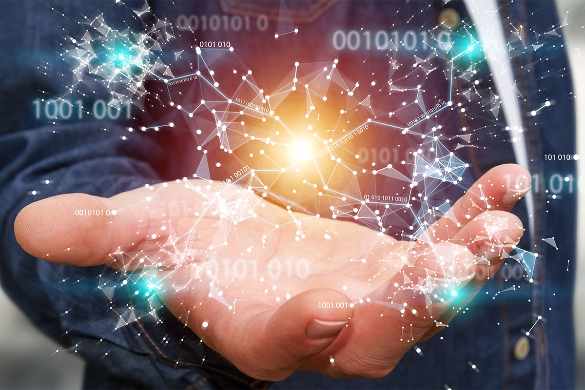 A businessman is holding his hand out to reveal a 3D render showing interconnected nodes and binary code.