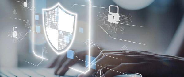 An individual types on a keyboard, surrounded by digital graphics representing cybersecurity elements, including a shield and padlock icons, indicating protection against online threats.