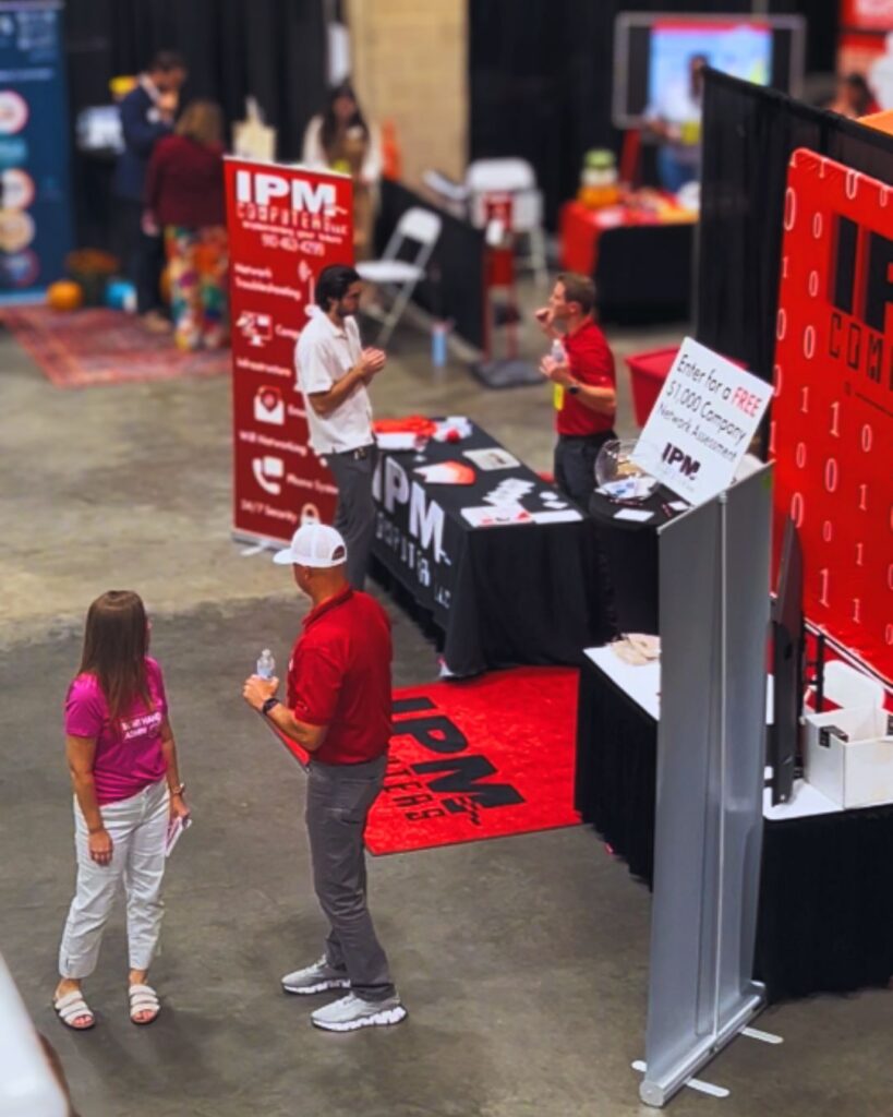 Discussing IT & Cybersecurity at the IPM Booth.