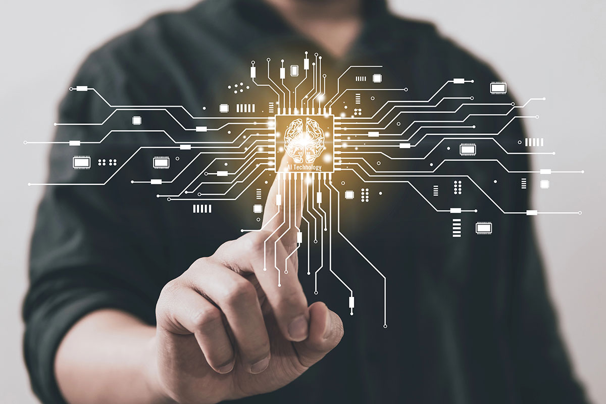 A person in a dark shirt touches a glowing circuit board with lines connecting various electronic components, featuring an icon of a brain labeled "AI Technology" at the center.