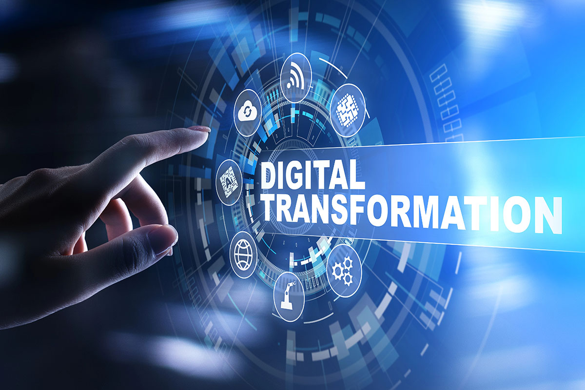 A hand reaching towards a digital interface displaying icons related to technology, with the words "DIGITAL TRANSFORMATION" prominently featured in the center.