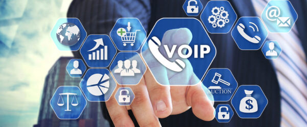 A businessman in a suit points towards a virtual touchscreen displaying various icons related to VoIP, communication, analytics, and online services.