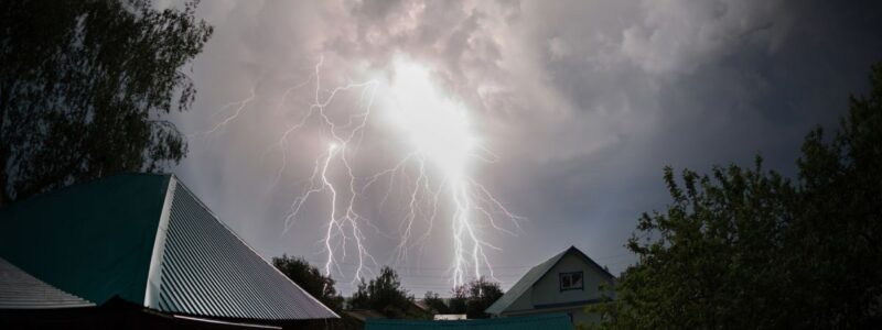 Lightning striking over a residential area.