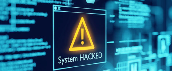 A digital display shows a warning message with an exclamation mark stating "System HACKED" against a backdrop of blue circuit-like graphics and lines of code.