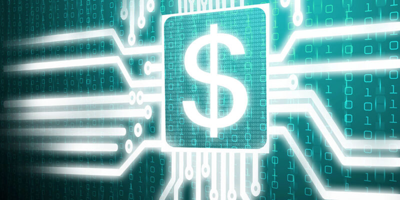 A glowing white dollar sign icon centered inside a microchip shape on a digital circuit board background. Glowing white trace lines extend outward from the central chip across a teal background filled with binary code and digital data patterns.